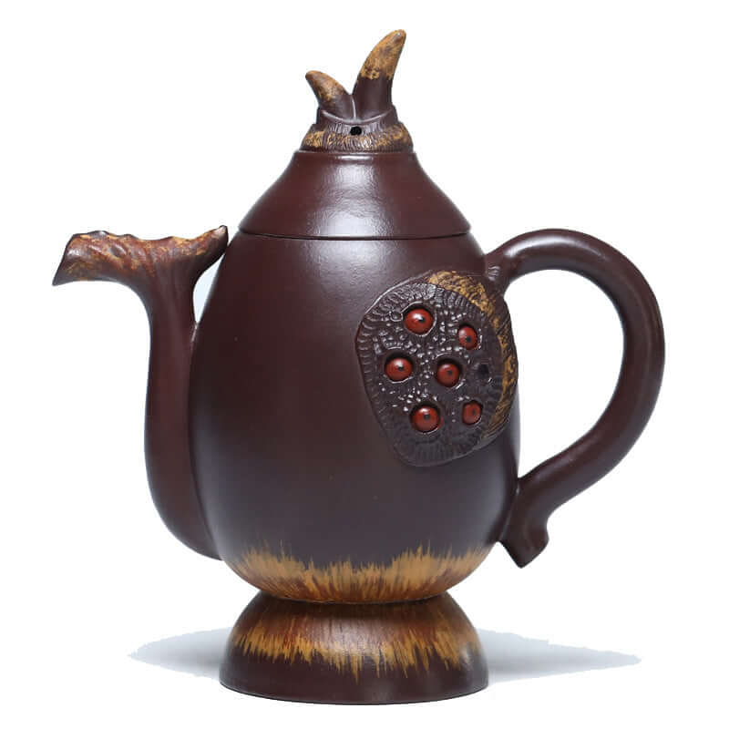 Handmade Yixing purple sand teapot with unique design, featuring textured body and decorative elements, ideal for tea enthusiasts.