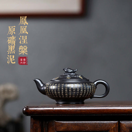 Handmade Yixing purple sand teapot in black mud, featuring intricate designs, ideal for tea enthusiasts.