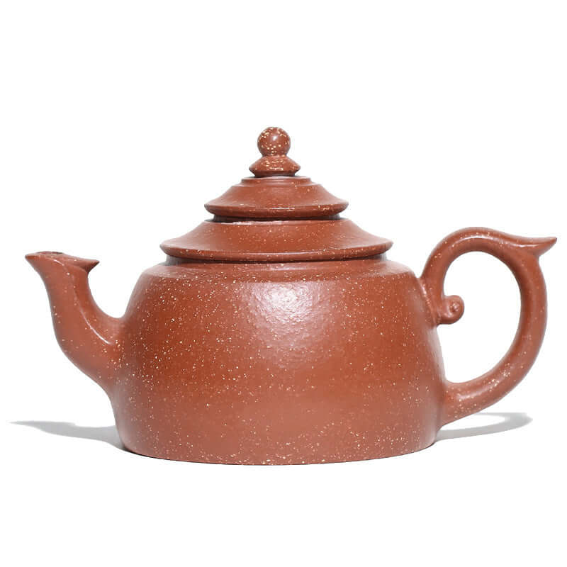 Handmade Yixing purple sand teapot featuring elegant curves and a traditional design.