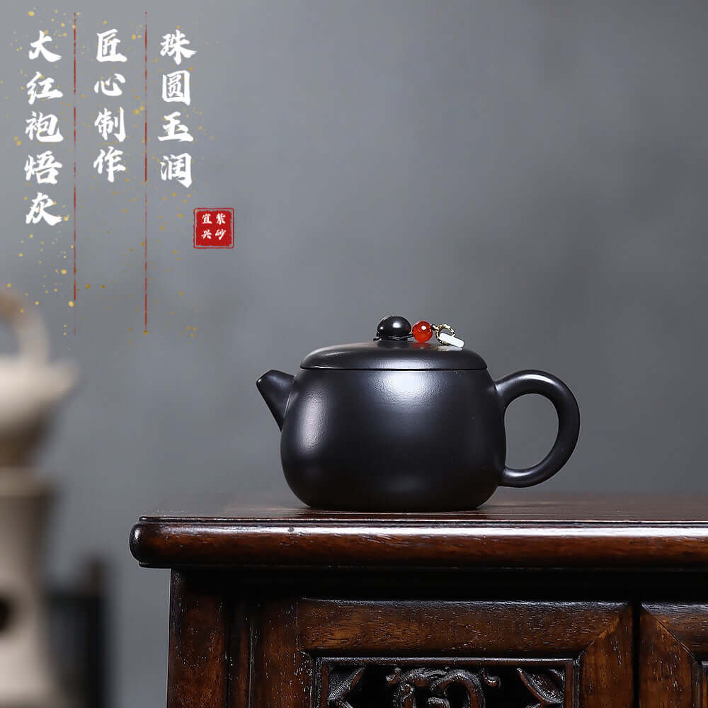 Handmade Yixing purple sand teapot with burnt gray bead, perfect for Kung Fu tea sets and home brewing.