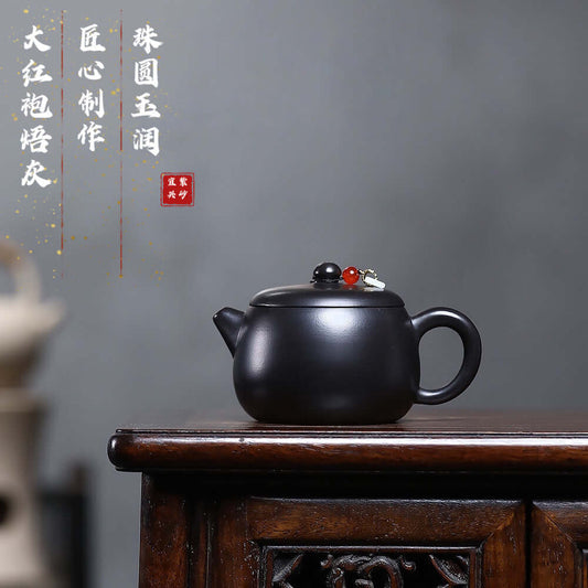 Handmade Yixing purple sand teapot with burnt gray bead, perfect for Kung Fu tea sets and home brewing.