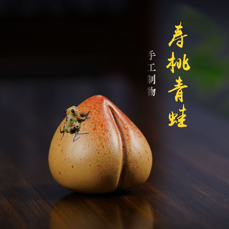 Handmade Yixing purple sand tea pet sculpture of a frog on gourd, showcasing original craftsmanship and unique design.