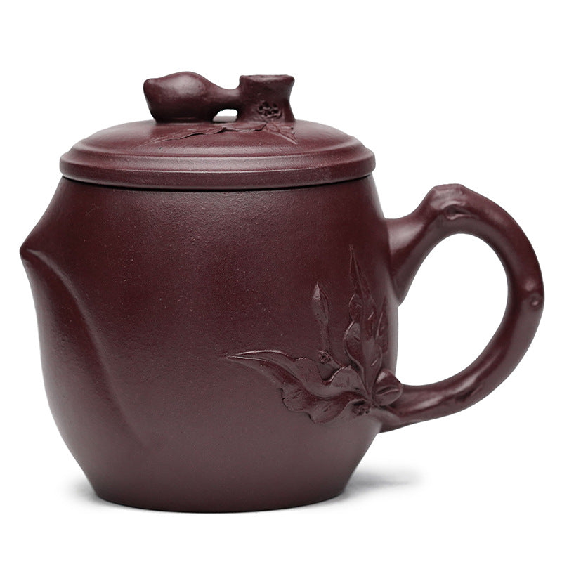 Handmade Yixing purple sand teapot with floral design, perfect for office or home tea enjoyment.