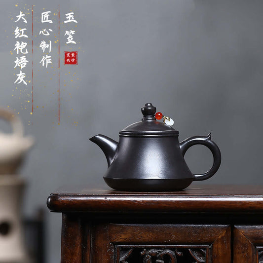 Handmade Yixing purple sand teapot, Original Da Hong Pao design, ideal for Kung Fu tea sets and home use.