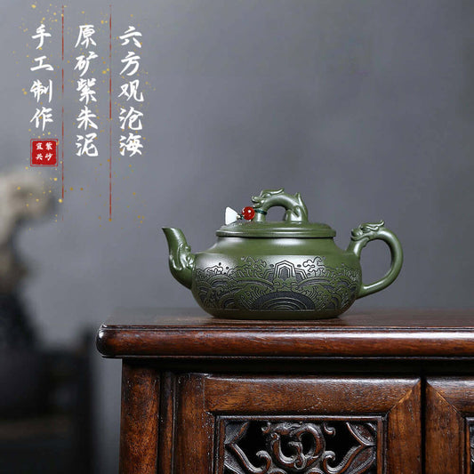 Handmade Yixing purple sand teapot in green clay, featuring intricate designs, perfect for kung fu tea sets.