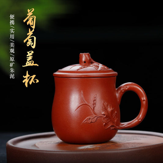 Handmade Yixing purple sand cup with intricate design, ideal for tea enthusiasts, showcasing authentic craftsmanship.