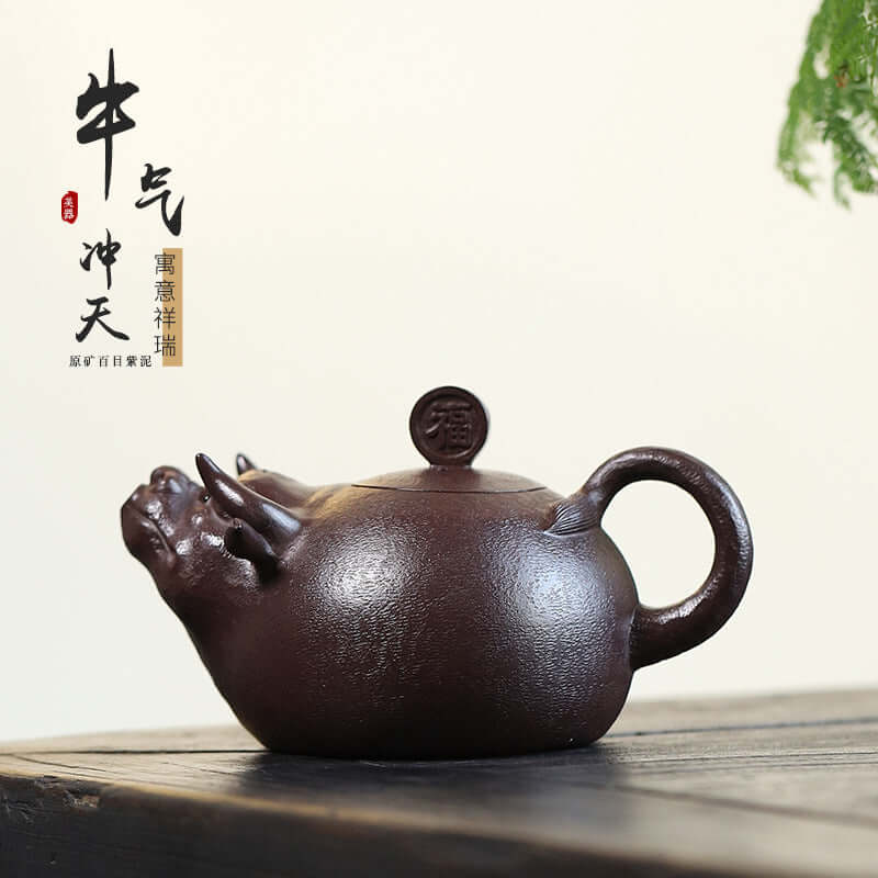 Handmade Yixing purple sand teapot with bull design, showcasing unique craftsmanship and traditional aesthetics.