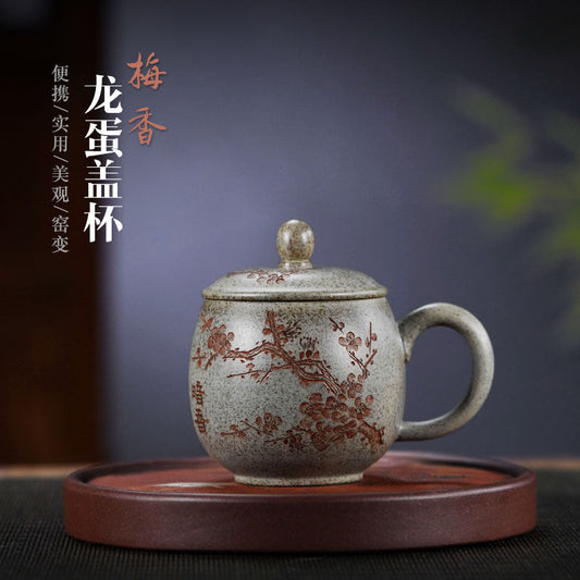 Handmade Yixing purple sand tea cup with lid, plum blossom design, crafted from raw mineral purple sand.