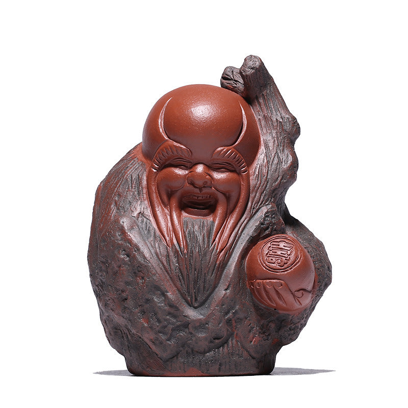 Handmade Yixing purple sand tea pet sculpture depicting a cheerful figure, perfect for tea tray decoration and good luck charm.