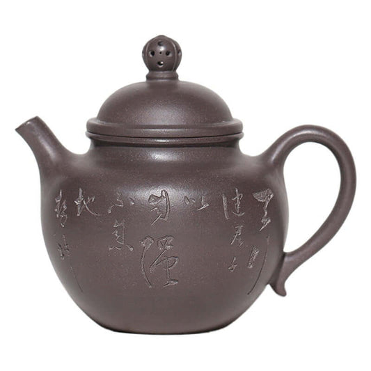 Handmade Yixing purple sand teapot with inscriptions, elegant design, ideal for tea brewing.