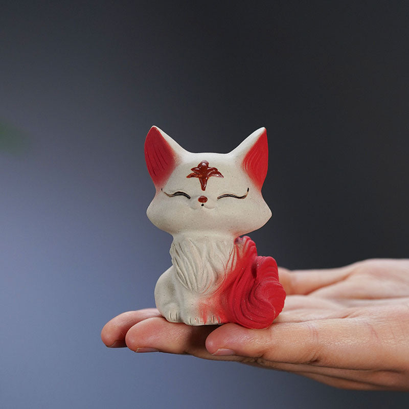 Handmade Yixing purple sand red nine-tailed fox ornament, perfect for tea ceremony or as a decorative gift.