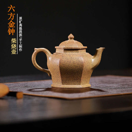 Handmade Yixing purple sand teapot on a textured mat, showcasing original craftsmanship and elegant design.