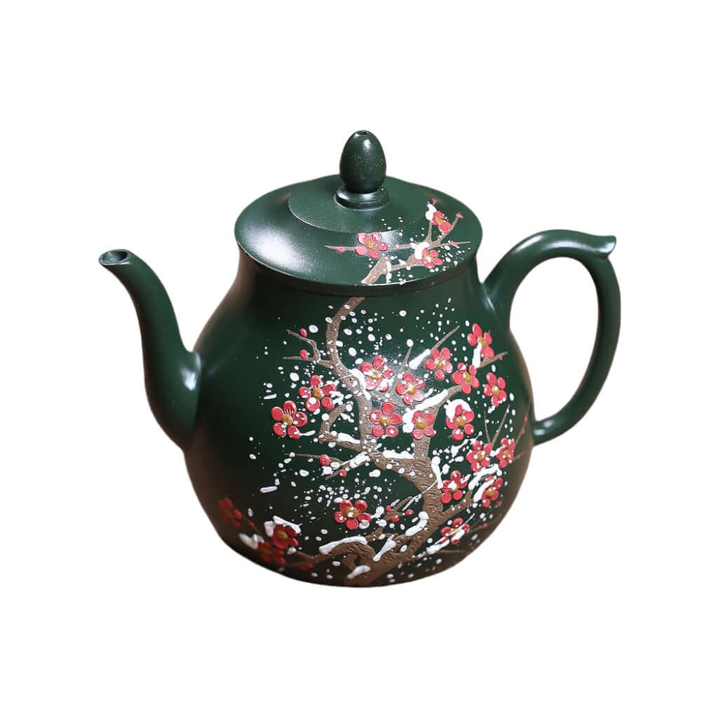 Handmade Yixing purple sand teapot in green, featuring intricate floral designs, perfect for Kung Fu tea ceremonies.