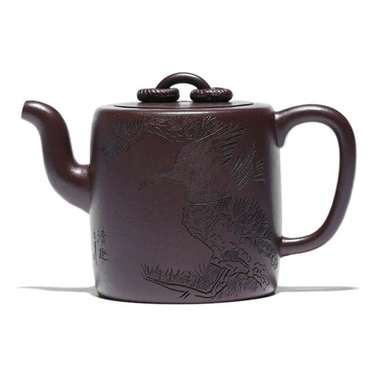 Handmade Yixing purple sand teapot with intricate bird design, showcasing traditional craftsmanship in rich purple clay.