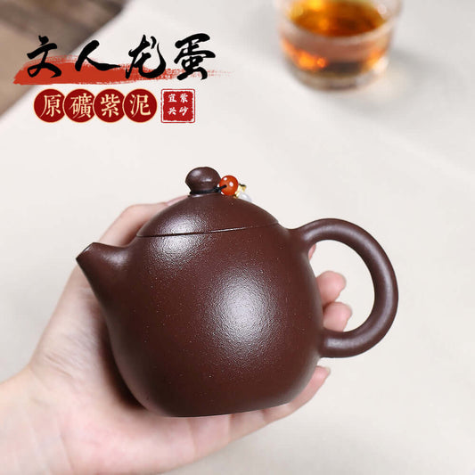 Handmade Yixing purple sand teapot, crafted by Yixing artisans, ideal for Kung Fu tea sets and home brewing.