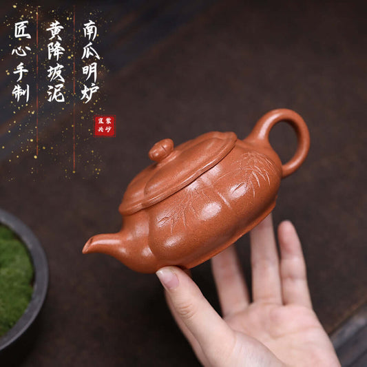 Handmade Yixing purple sand teapot in pumpkin shape, showcasing traditional craftsmanship and original yellow slope mud.