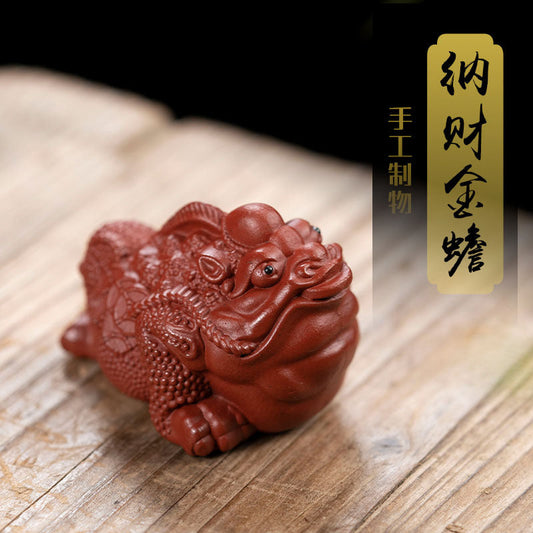 Handmade Yixing purple sand tea pet ornament, crafted with attention to detail for tea lovers, featuring a traditional design.