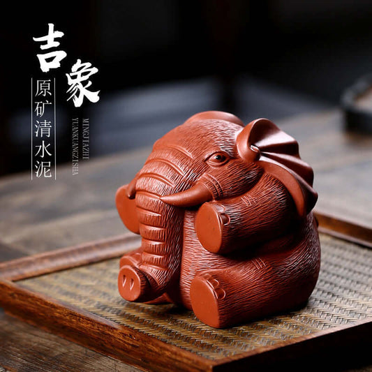 Handmade Yixing purple sand Lucky Elephant sculpture, detailed craftsmanship, perfect for tea table decoration.