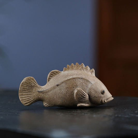 Handmade Yixing purple sand tea pet model of a mandarin fish for early education and decor.