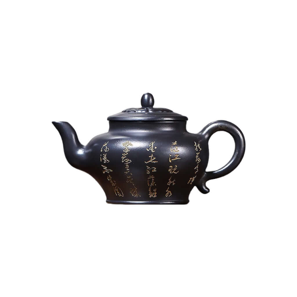 Handmade Yixing purple sand teapot with gold inscriptions, perfect for Kung Fu tea ceremonies, unique artisan craft.