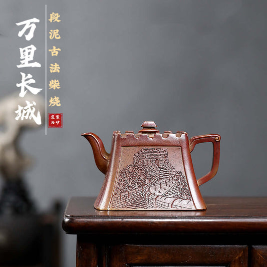 Handmade Yixing purple sand teapot featuring Great Wall design, crafted from raw ore for tea enthusiasts.