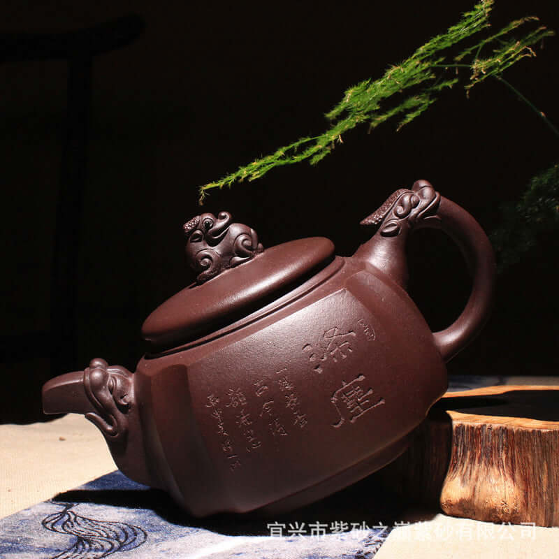 Handmade Yixing purple sand teapot with intricate carvings and elegant design, ideal for Kung Fu tea ceremonies.