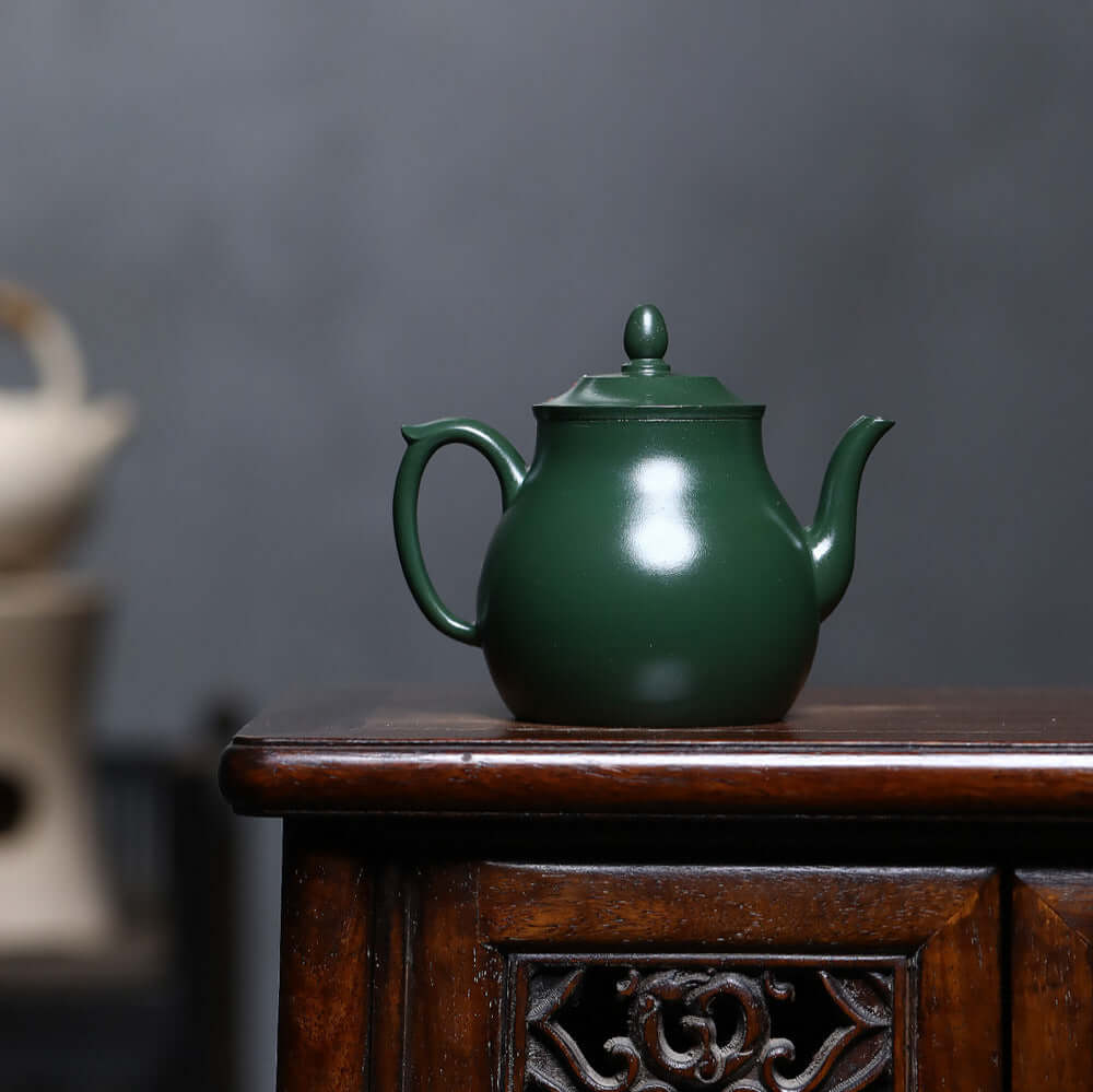 Handmade Yixing purple sand teapot in ink green mud, perfect for home kung fu tea set.