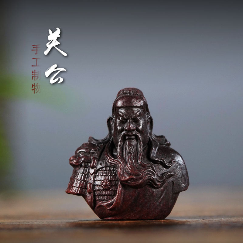Handmade Yixing purple sand Guan Gong ornament sculpture, a unique tea pet for tea enthusiasts and collectors.