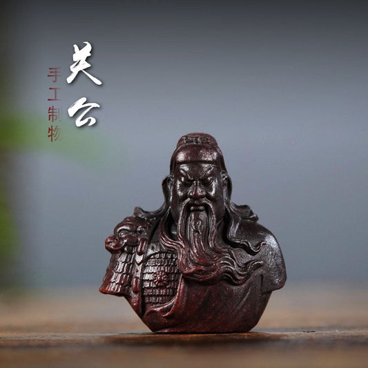 Handmade Yixing purple sand Guan Gong ornament sculpture, a unique tea pet for tea enthusiasts and collectors.