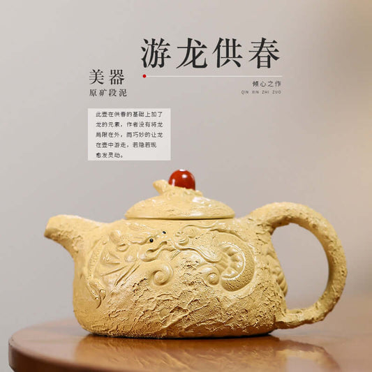 Handmade Yixing purple sand teapot with intricate design and red lid, showcasing traditional craftsmanship.