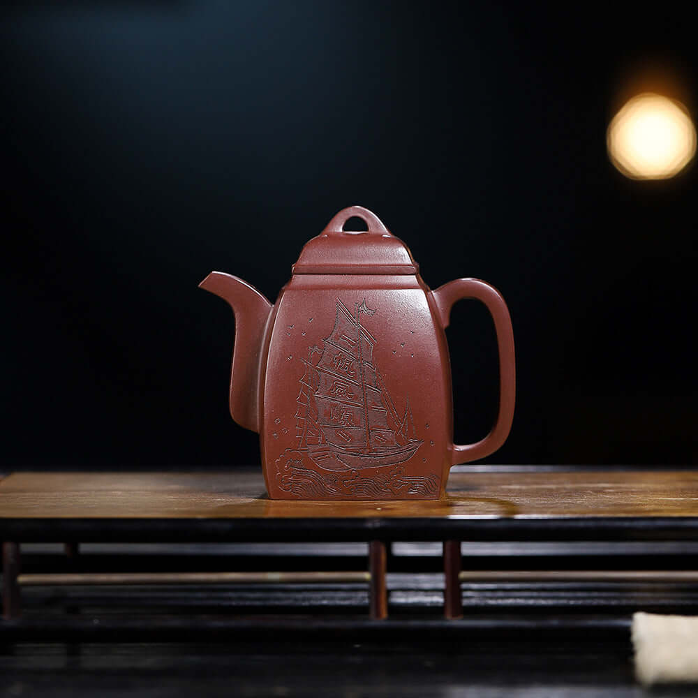 Handmade Yixing purple sand teapot featuring a ship design, perfect for tea enthusiasts and high-end gifts.