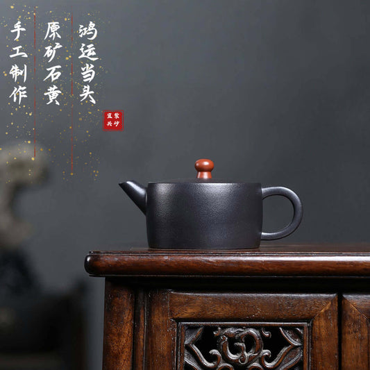 Handmade Yixing purple sand teapot with a wooden handle, perfect for traditional Kung Fu tea ceremonies.