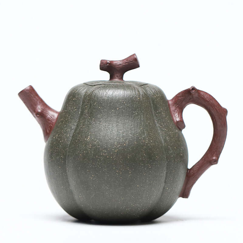 Handmade Yixing purple sand teapot in pear melon shape, featuring a natural bark handle, artistic and elegant design.