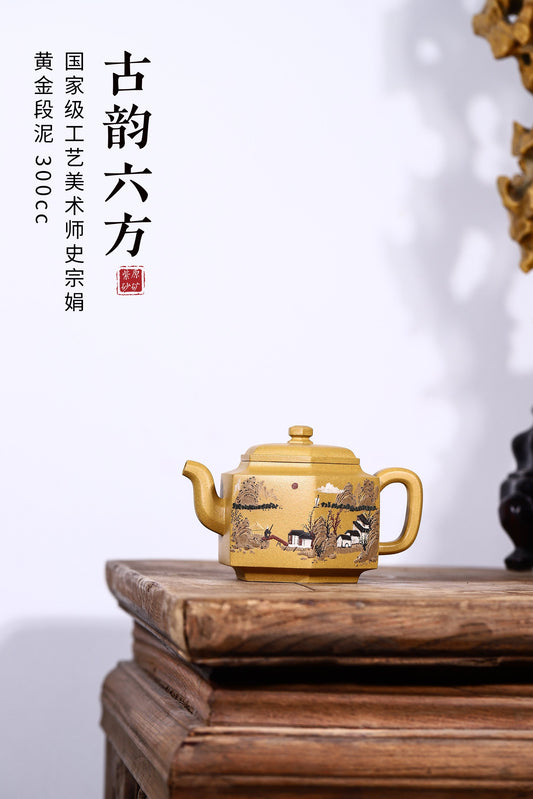 Handmade Yixing purple sand teapot in classic six-sided design, featuring intricate mountain scenery, 300CC capacity.