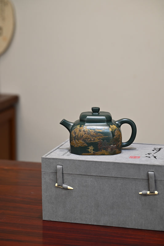 Handmade Yixing purple sand teapot displayed on a gift box, showcasing exquisite craftsmanship and traditional design.