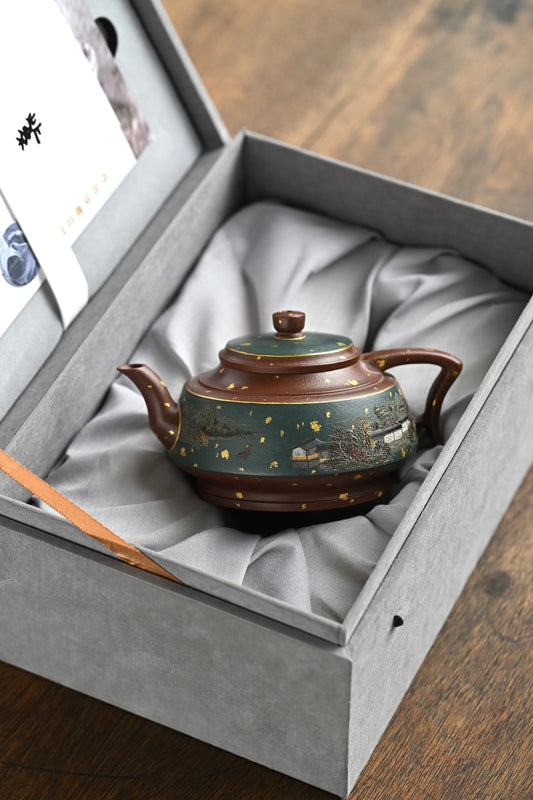 Handmade Yixing purple sand teapot displayed in a luxurious gift box, showcasing craftsmanship and elegance.