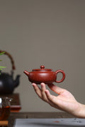 全手工【铺砂周盘】 制壶：殷俊雅（国家级工艺美术员） 泥料：原矿铺砂朱泥 容量：120cc