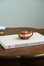 舒和·全手工 /容量100cc/朱泥珐琅彩 身扁腹鼓，壶意舒展清和