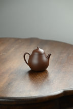 茄瓜·全手工 /容量180cc/原矿老紫泥 形式娇巧，若一茄瓜熟落，湾流微微翘起