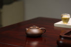 『憨瓢』·老紫泥·160cc·内推9孔  憨厚，兼具石瓢古拙味，捺底浑然天成，极致内推，出汤利索，泥色温润，泡养油性上佳（许雪强）