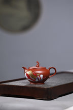 研高收藏重器【 笑口常开】 作者：刘红仙 职称：研究员级高级工艺美术师 装饰：孙燕明 中国工艺美术大师 容量： 180cc 泥料： 稀有可心朱泥