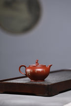 研高收藏重器【 笑口常开】 作者：刘红仙 职称：研究员级高级工艺美术师 装饰：孙燕明 中国工艺美术大师 容量： 180cc 泥料： 稀有可心朱泥