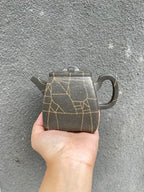 High stone teapot by Yang Junbao, handmade zisha teapot with elegant design, showcasing unique clay texture.