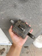 High stone teapot by Yang Junbao held in hand, showcasing unique design and craftsmanship in zisha clay.