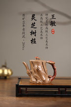 《灵芝树桩》 王敏 正高级工艺美术师 江苏省工艺美术协会会员 中国民间工艺美术协会会员 作品简介：原矿95年老段泥，260cc，内推球孔出水