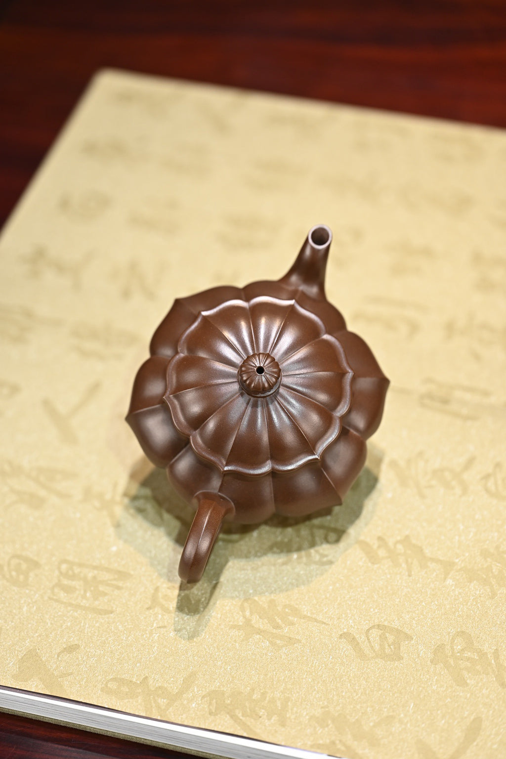 Handcrafted purple clay teapot 200cc on decorative paper, showcasing unique design and craftsmanship.