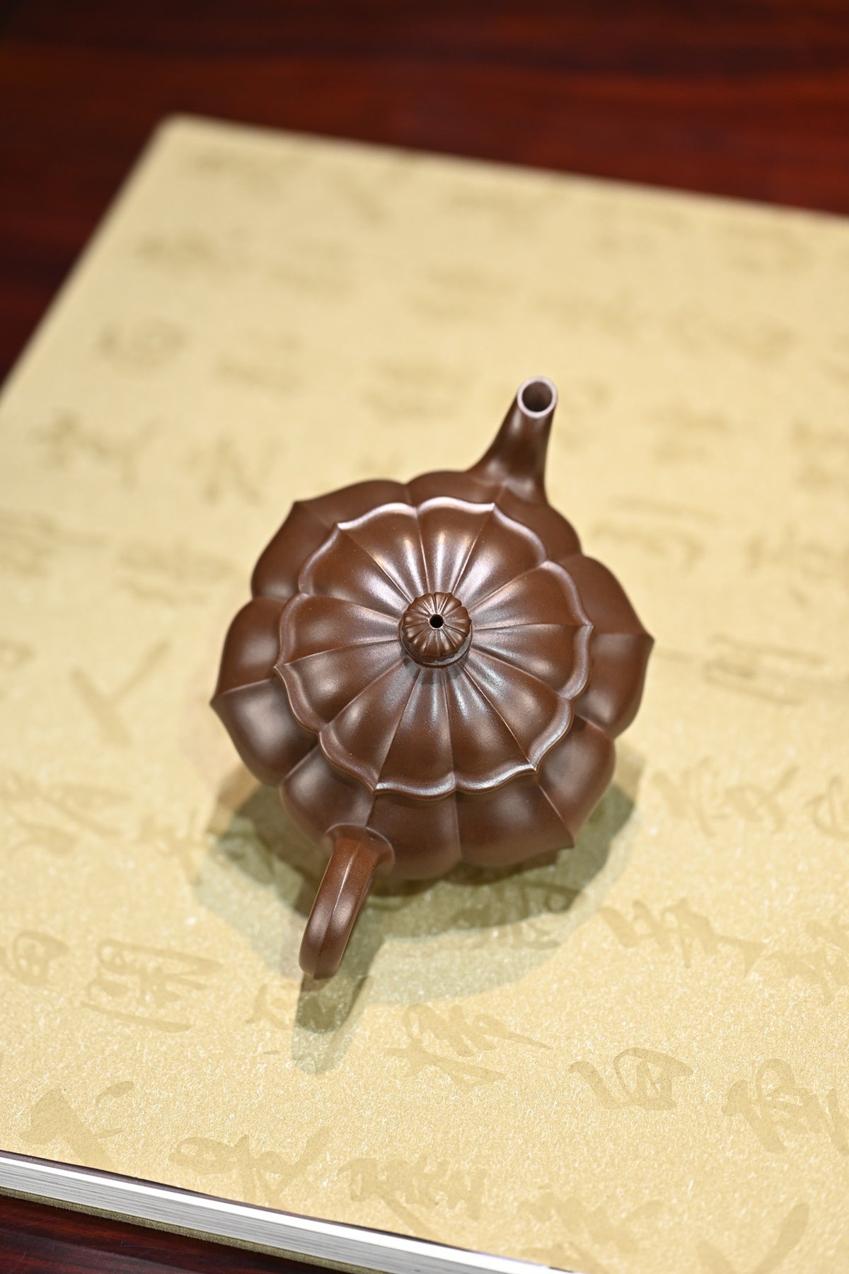 Handcrafted purple clay teapot 200cc on decorative paper, showcasing unique design and craftsmanship.