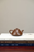 子冶石瓢·全手工/容量200cc/极品紫泥 器形具备深厚的古意，用线之单纯、凝练、清澄透明一气呵成